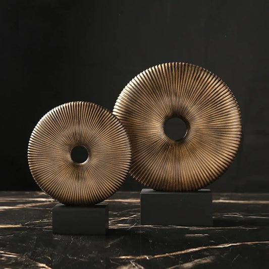 Elegant gold openwork ring sculpture, modern decor accent piece by Decorbites, showcasing intricate openwork design for home decor.