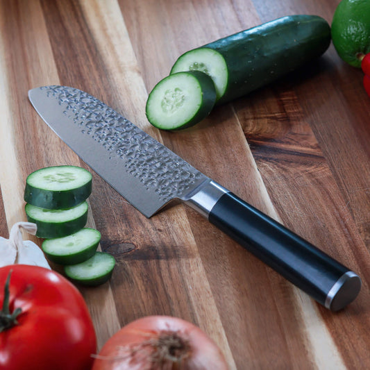 Swiss Diamond 7-inch hammered Santoku knife with ergonomic handle and sharp blade for precise slicing and chopping.