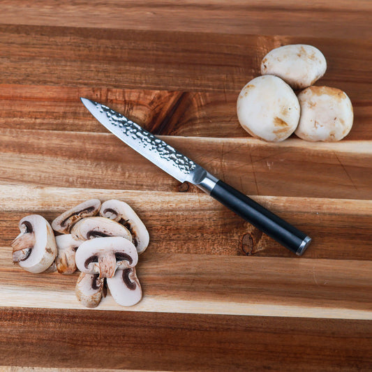 Hammered 5-inch utility knife by Swiss Diamond, featuring a durable blade and ergonomic handle for versatile kitchen use.
