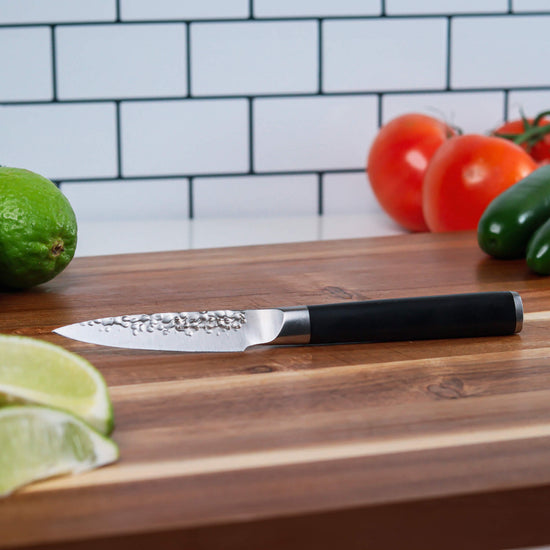Swiss Diamond 4-inch hammered paring knife with stainless steel blade and ergonomic handle for precise kitchen prep.