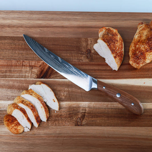 Swiss Diamond 8-inch Damascus carving knife with a detailed patterned blade and ergonomic handle for precise slicing.