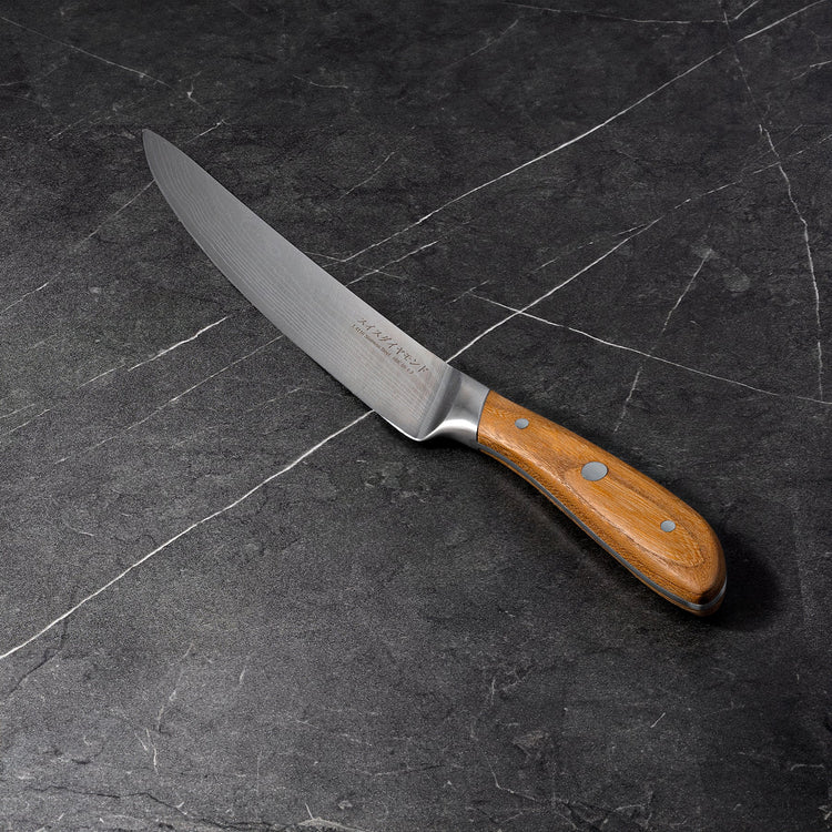 Swiss Diamond 8-inch Damascus carving knife with a sharp, patterned blade for precise slicing and elegant presentation.