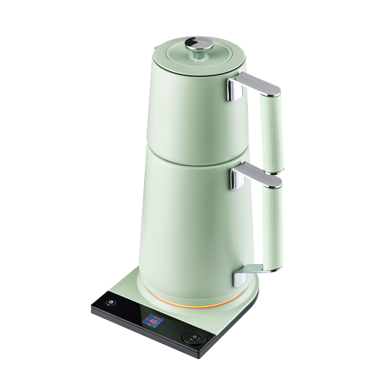 Saki Turkish Tea Maker Pro in sage green with glass pot and stainless steel handle for brewing traditional Turkish tea.