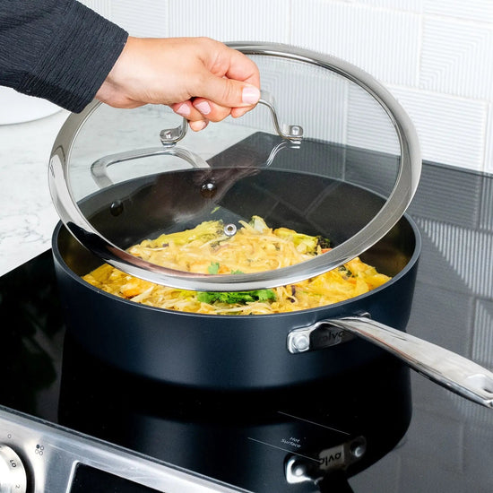 Alva Cookware 4-quart sauté pan with lid, versatile skillet for cooking and sautéing, black non-stick interior and stainless steel handle.