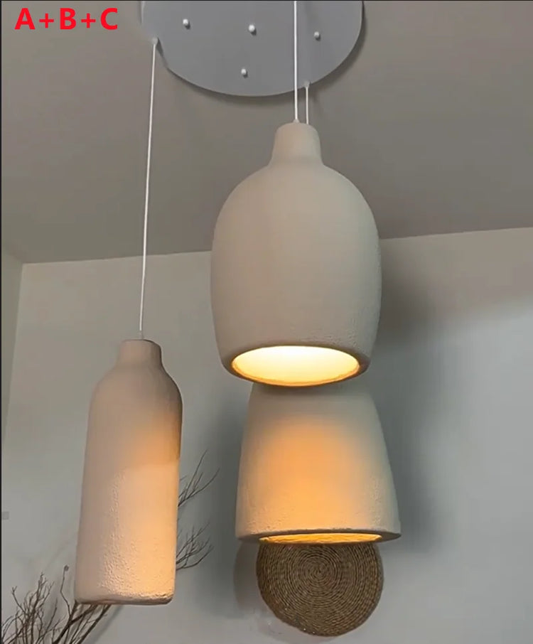 LED chandelier cement hanging light by DECORBITES, modern industrial design with a sleek cement finish and multiple LED bulbs.