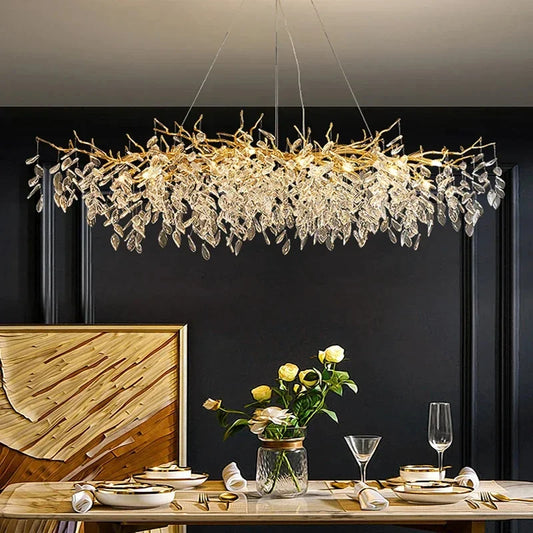 Gold crystal LED chandelier by DECORBITES with sparkling crystal accents and modern design, hanging with warm lighting.