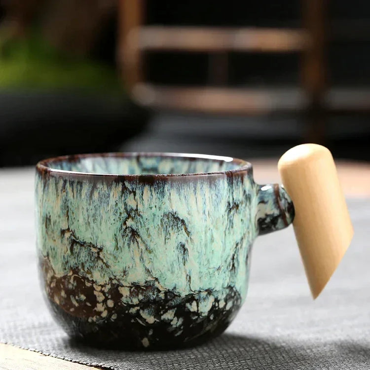 DecorBites ceramic latte mug with wooden handle, 130–150ml coffee cup, featuring a stylish design and comfortable grip.