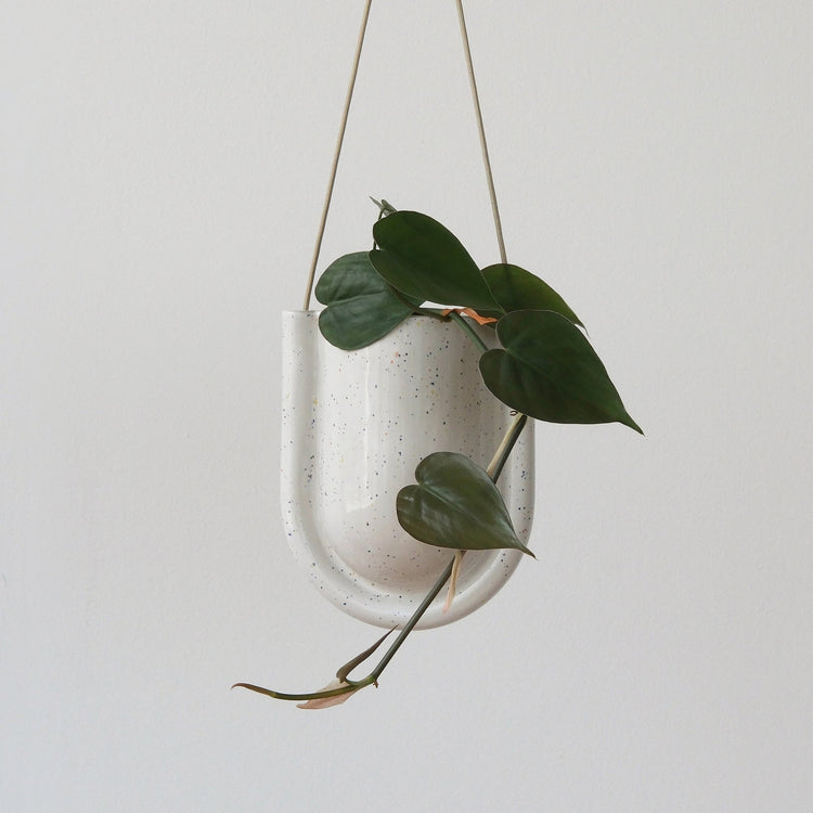 Speckled green Misewell Portico planter with a round shape and textured surface, perfect for indoor or outdoor plant display.