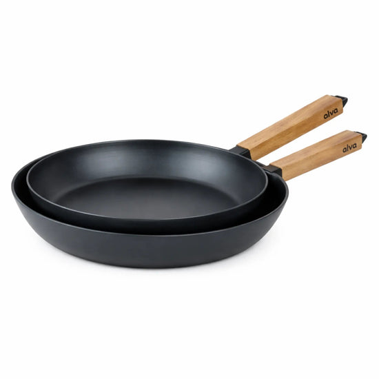 Alva Cookware frying pan with a non-stick surface and wooden handle, shown on a stovetop with a close-up view.