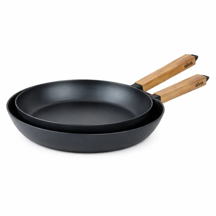 Alva Cookware frying pan with a non-stick surface and wooden handle, shown on a stovetop with a close-up view.