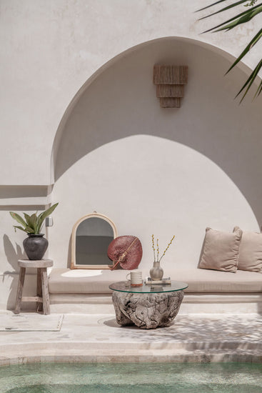 Handmade arch rattan wall mirror with natural boho design, featuring a warm woven rattan frame and a clear reflective surface.