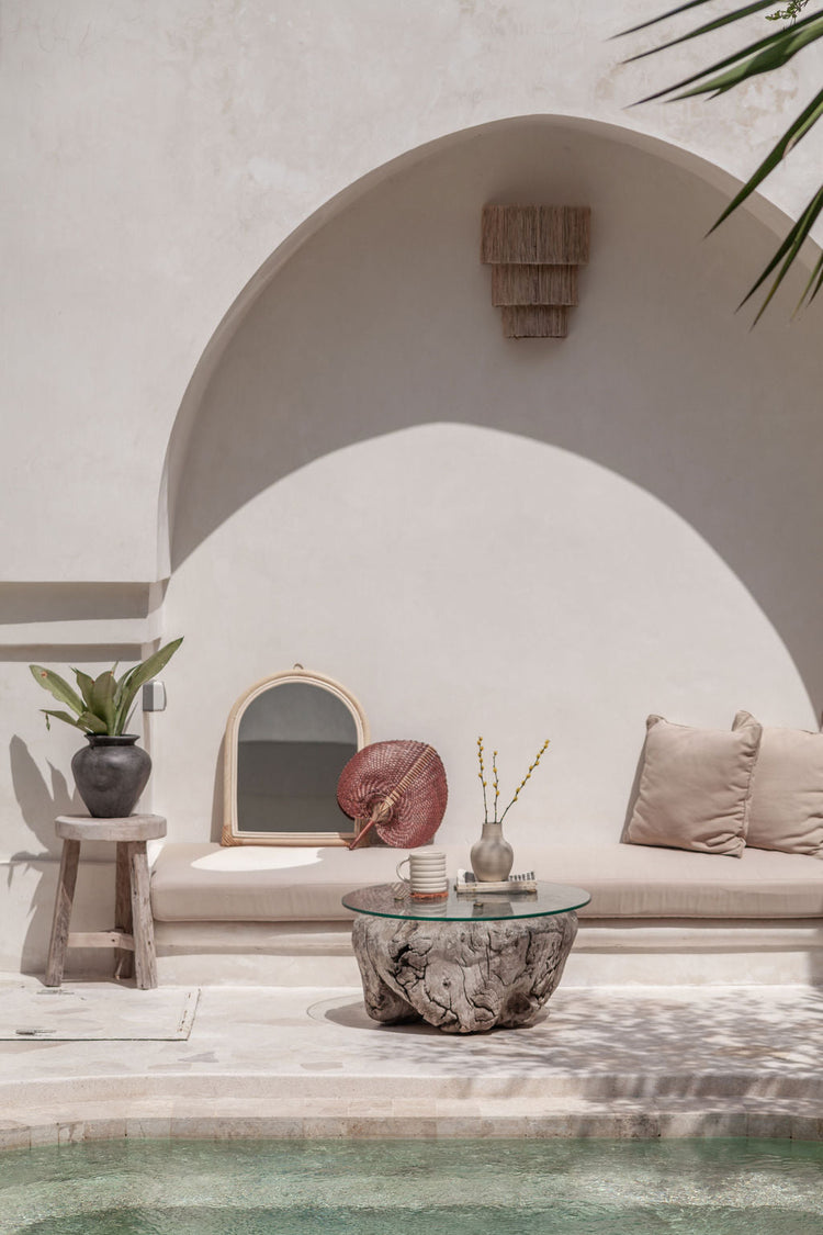 Handmade arch rattan wall mirror with natural boho design, featuring a warm woven rattan frame and a clear reflective surface.