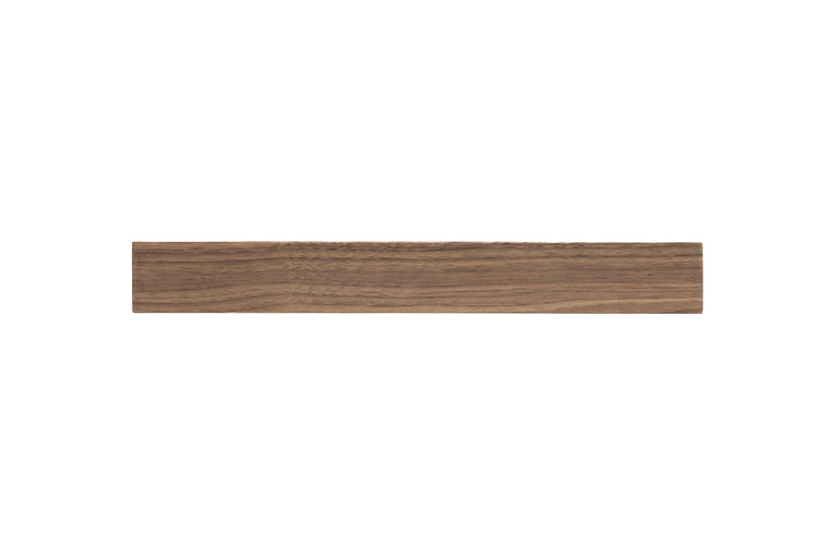 Walnut wood floating kitchen shelves by Dogberrycollections mounted on a wall, showcasing their sleek, modern design for kitchen storage.