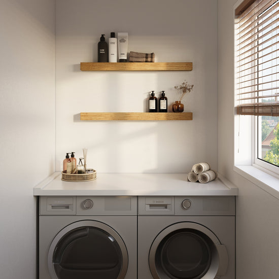 White oak floating kitchen shelf by Dogberrycollections, mounted in a laundry room setting with decorative items.