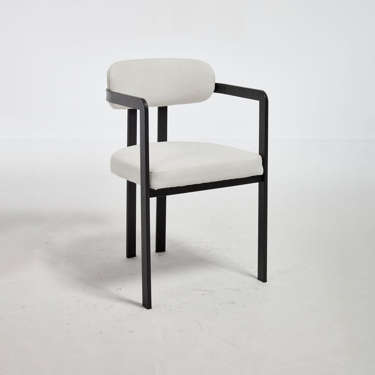 Set of two HouseOfZazla dining arm chairs with plush upholstery and wooden legs, ideal for modern dining rooms.