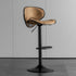 Modern Scandinavian chair by FLIPSTYLEZLLC featuring a minimalist design with light wood legs and a sleek, neutral-colored seat.