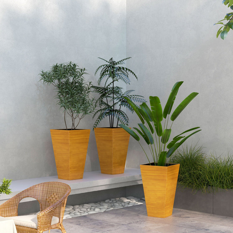 Set of three 28-inch tall outdoor garden planters by Gallery La La, tan faux wood plastic pots with drainage holes for patio or garden.