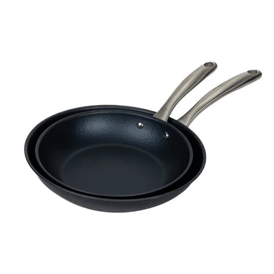 Black Alva Cookware frying pan with a non-stick surface, shown from above on a stovetop.