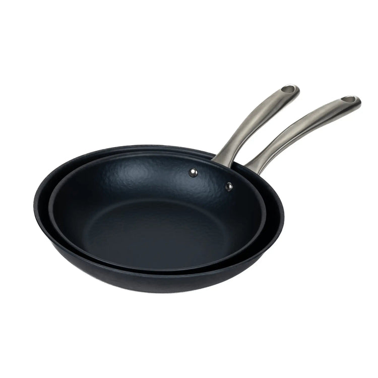 Black Alva Cookware frying pan with a non-stick surface, shown from above on a stovetop.