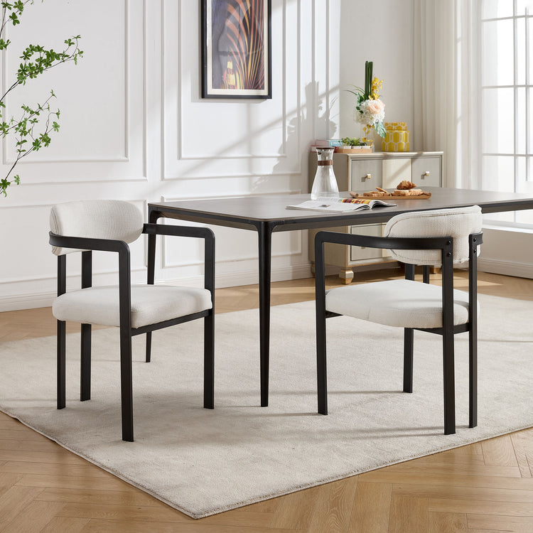 Set of two HouseOfZazla dining arm chairs with wooden legs and upholstered seats, featuring a modern design.