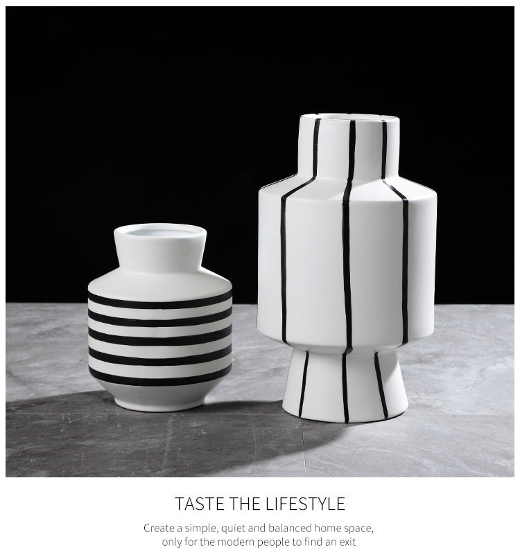Black and white striped ceramic vase by FLIPSTYLEZLLC, modern light luxury home decor piece.