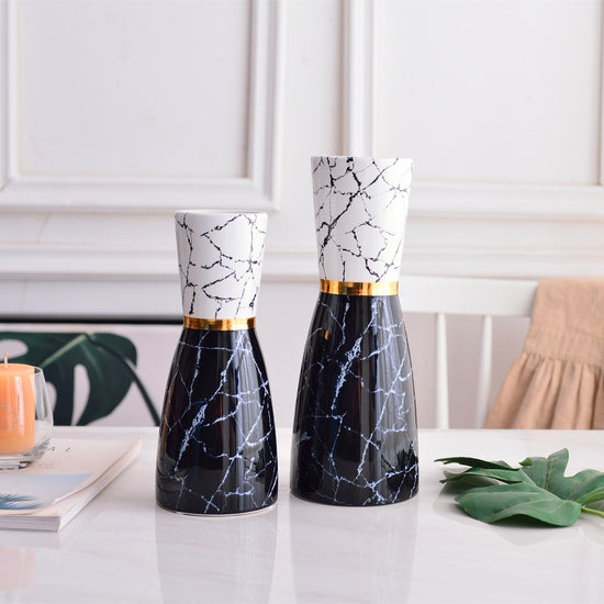 Modern marbled golden ceramic vase with a sleek, simple design, perfect for adding luxury style to home decor.