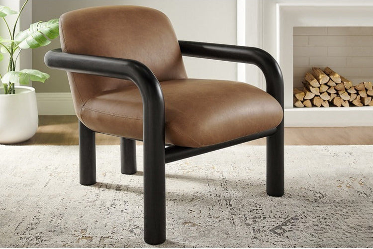 Modern faux leather accent chair with brown and black wood frame, showcasing a stylish armchair design from Gallery La La.
