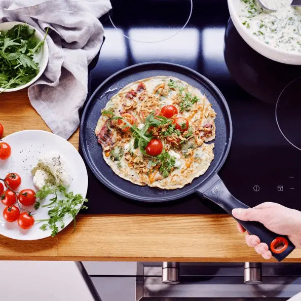 Alva Cookware 11-inch nonstick crepe and egg pan with a flat griddle surface for perfect pancakes and breakfast dishes.
