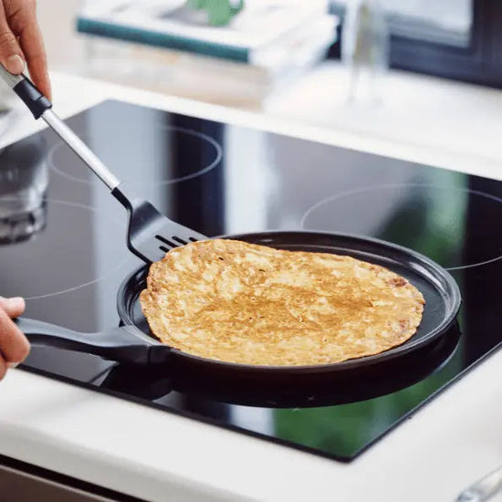 Alva Cookware 11-inch crepe and egg pan with nonstick surface, ideal for making pancakes and breakfast dishes.