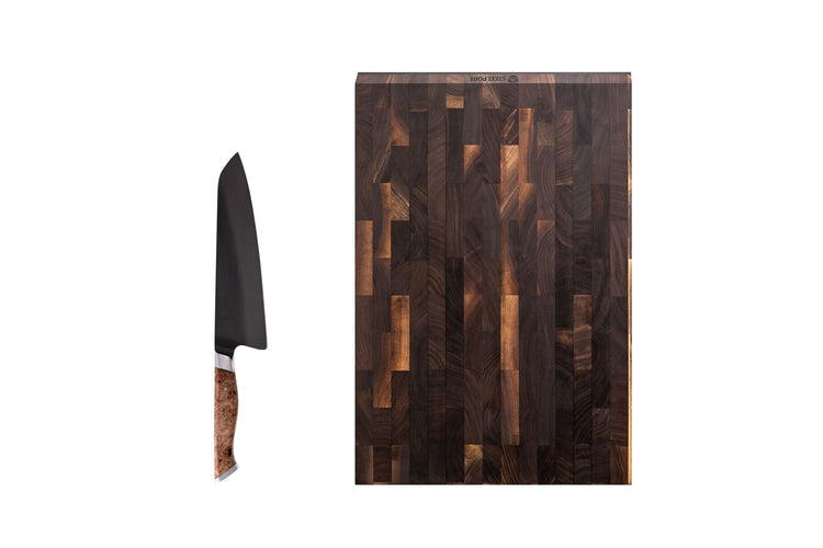 Steelport Knife Co. everyday knife and cutting board set displayed on white background, includes a chef's knife and a wooden cutting board.