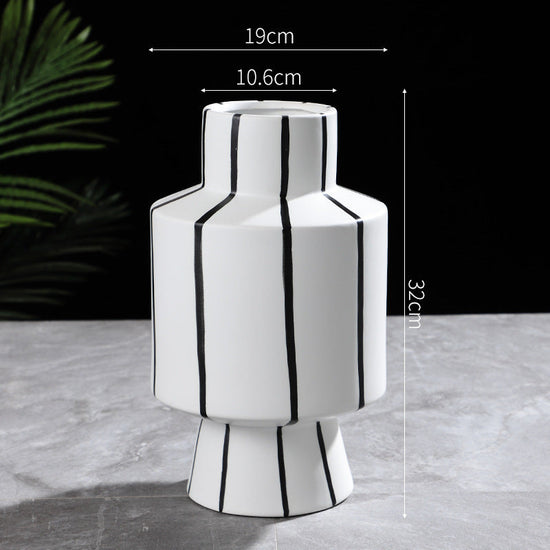 Black and white striped ceramic vase with a modern, light luxury design, perfect for contemporary home decor by FLIPSTYLEZLLC