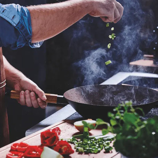 12-inch carbon steel wok from Alva Cookware, featuring a traditional round-bottom design perfect for stir-frying.