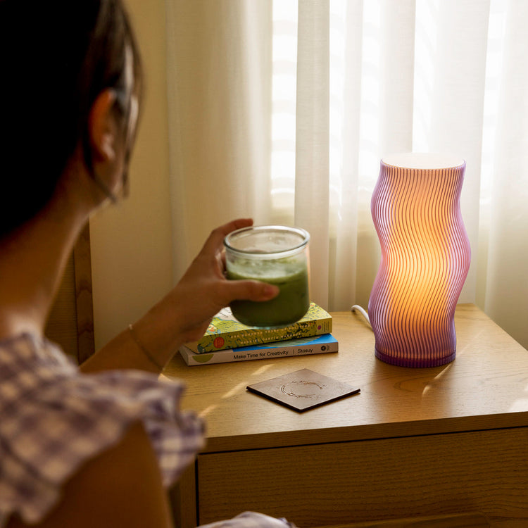Purple Terra Labs Woogie Table Lamp with rounded base and modern design, perfect for adding a stylish touch to your space.