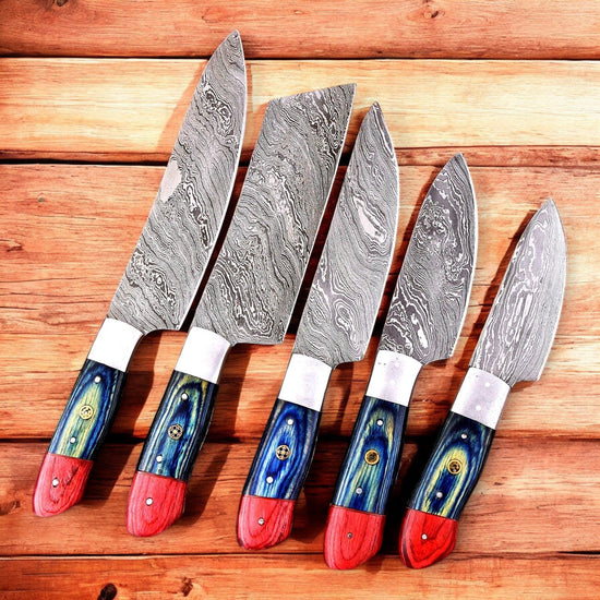 Handmade Damascus Steel kitchen knife set with exotic wood handles, featuring multiple knives displayed on a wooden surface.