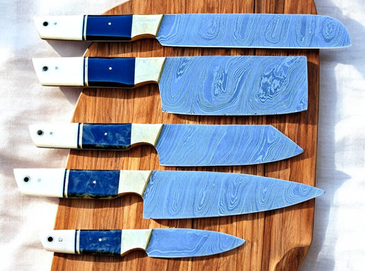 Premium handmade Damascus kitchen knives set with resin and bone handles, showcasing sharp blades and elegant craftsmanship.