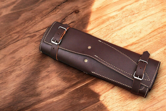 Handmade Damascus kitchen knives set with sharp blades, featuring polished steel and ergonomic handles for precision cooking.
