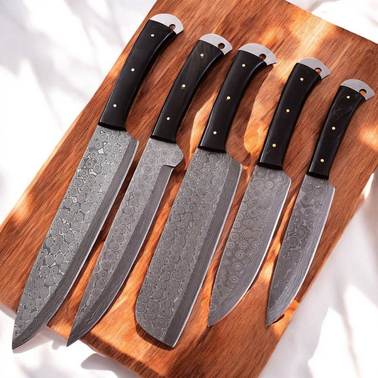 Handmade Damascus kitchen knives set with buffalo horn handles, featuring sharp blades and elegant craftsmanship.