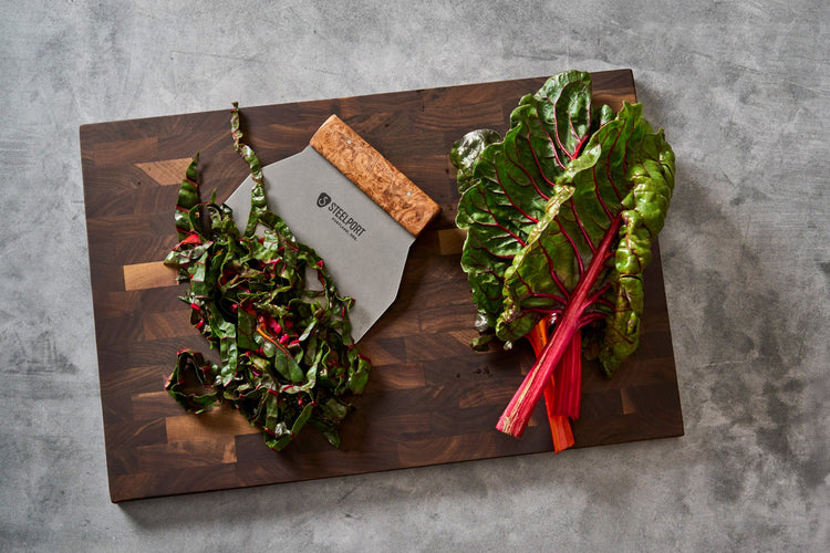SteelCore™ Cutting Board from STEELPORT Knife Co., 18x12 inches, featuring a durable stainless steel surface with a built-in scraper.