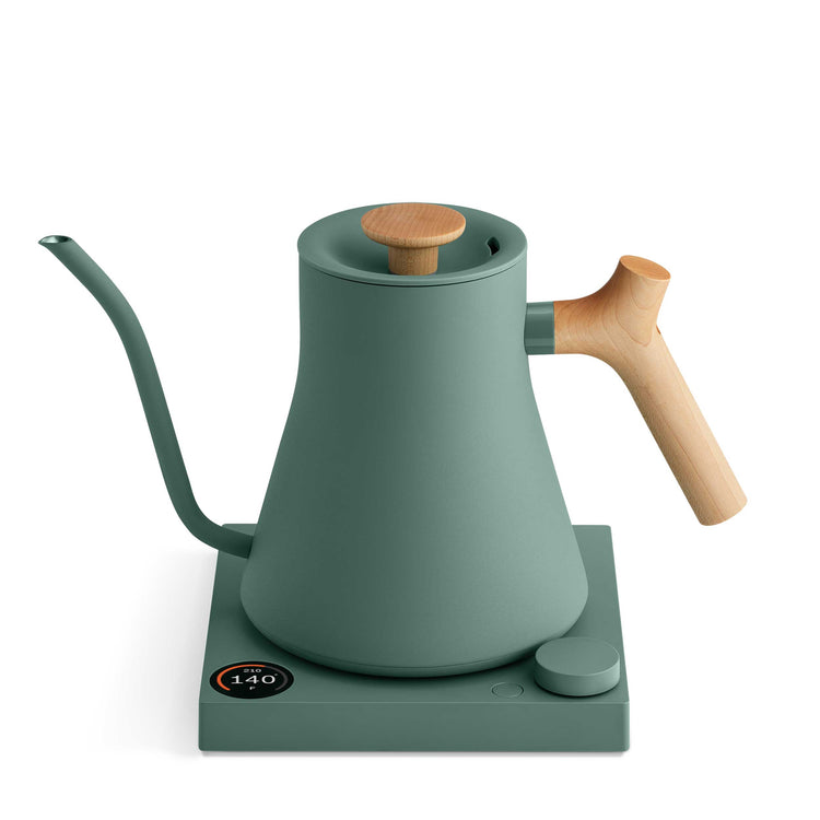 Fellow Stagg EKG Pro electric kettle in smoke green with a maple handle, showcasing its sleek design and digital controls.
