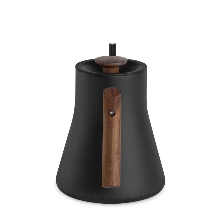 Fellow Stagg EKG Pro electric kettle in matte black with walnut handle and accents, sleek kitchen appliance for precise pouring.