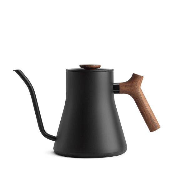 Fellow Stagg EKG Pro electric kettle in matte black with walnut handle, showcasing its sleek design and spout.