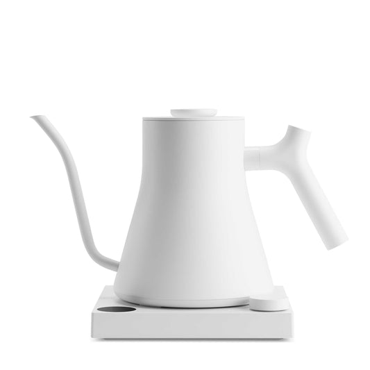 Fellow Stagg EKG Pro electric kettle in matte white with digital display and sleek handle, designed for precise coffee brewing.