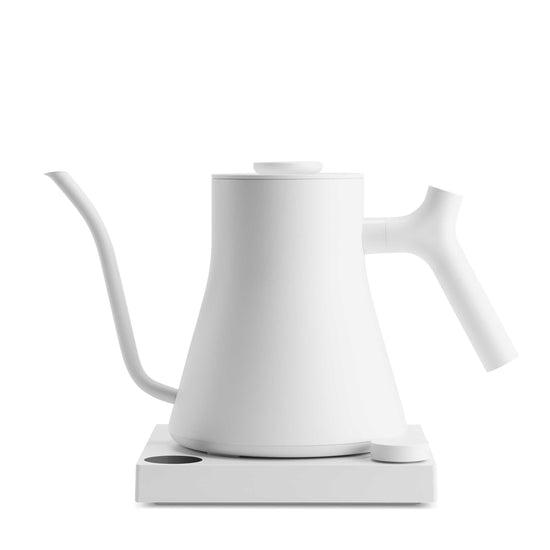 Fellow Stagg EKG Pro electric kettle in matte white with digital display and sleek handle, designed for precise coffee brewing.