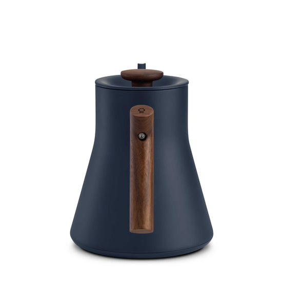 Fellow Stagg EKG Pro electric kettle in stone blue with walnut handle, sleek design, and digital temperature control.