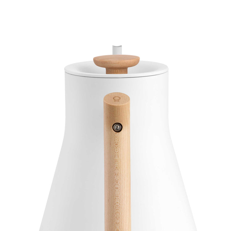 Fellow Stagg EKG Pro electric kettle in matte white with maple handle and accents, designed for precise pour-over brewing.
