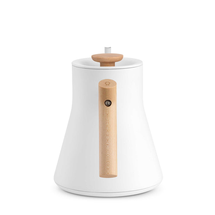 Fellow Stagg EKG Pro electric kettle in matte white with maple handle and accents, featuring a sleek modern design.
