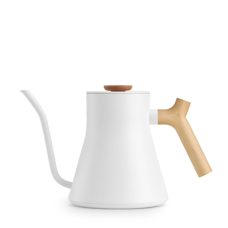 Fellow Stagg EKG Pro electric kettle in matte white with maple handle, featuring a sleek design and digital temperature control.