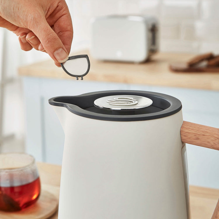 Swan Nordic 1.7L cordless stainless steel kettle with wood effect handle and 1500W rapid boil feature, kitchen appliance.