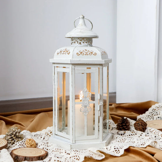 White and gold decorative 12-inch medium candle lantern by JHY DESIGN with vintage-style design and metal handle.
