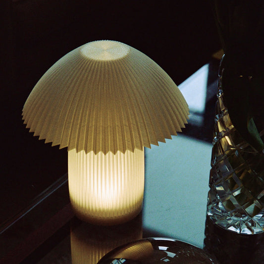 Cordless Kinoko Lamp by Wooj Design, featuring a mushroom-shaped LED light with a sleek, modern design and portable cordless functionality.